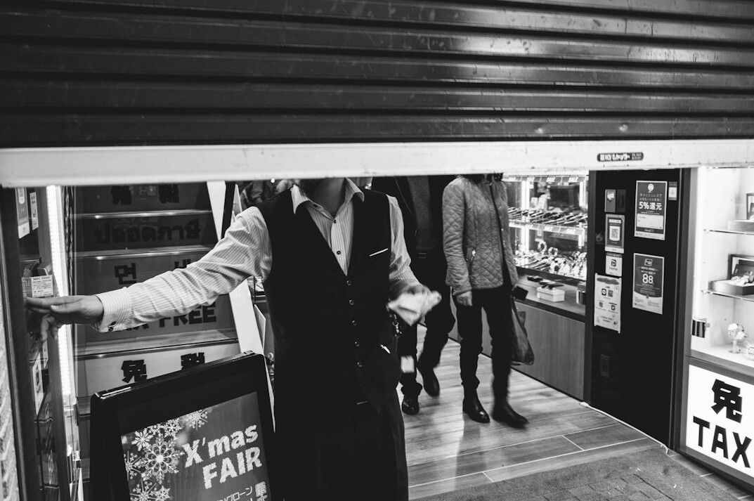 store security guard watching customers