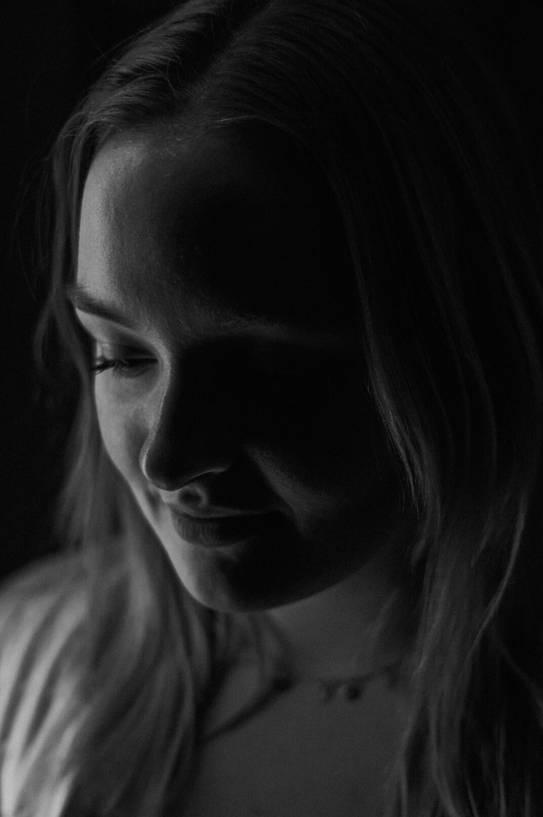 Portrait of a woman with light hair smiling gently