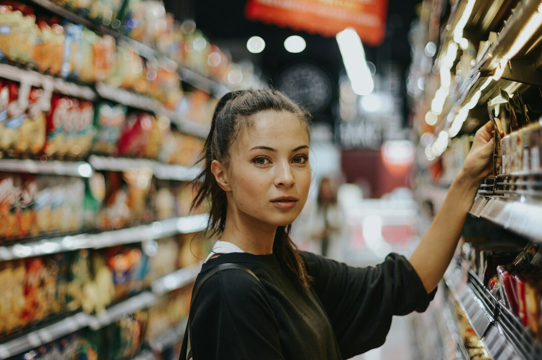 retail employee checking tags