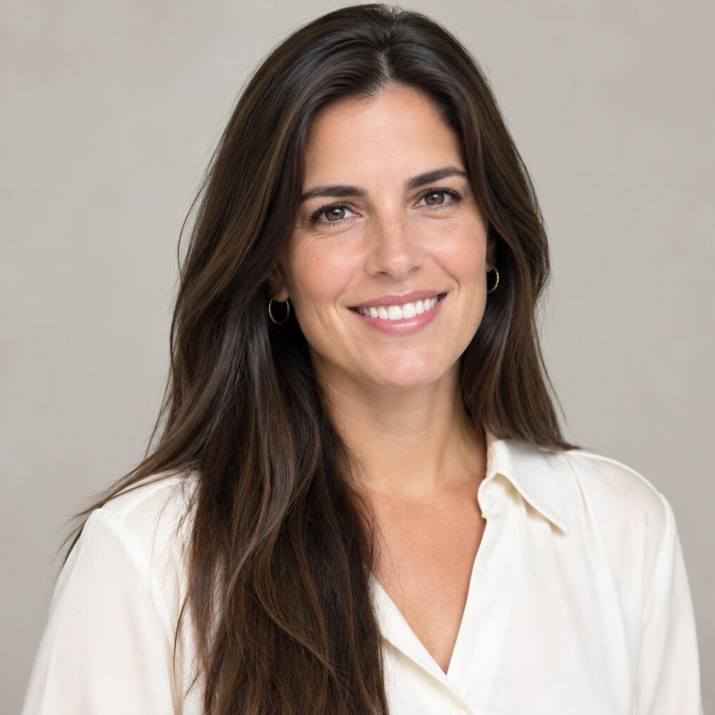 Portrait of a young woman with long brown hair smiling